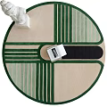 Round Rug in Beige Green Black with Geometric Lines and Book on White Statue Base