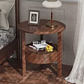 Wooden Round Bedside Table With Photo Frame Table Lamp Books And Fruits On Storage Shelf