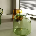 Modern Glass Stool With Green Yellow Vases On White Countertop By Window Blinds