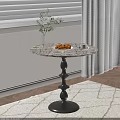 Marble Top Side Table with Black Spiral Base Holding Croissants Coffee and White Flower Vase