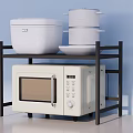Modern Kitchen Appliances Featuring Microwave Oven And White Pots On Black Rack