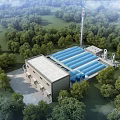 Modern Industrial Factory Building With Blue Roof Surrounded by Lush Green Trees And Tall Chimney