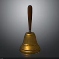 Golden Bell with Wooden Handle and Polished Brass Surface on Black Background
