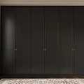 Dark Colored Built In Wardrobe With Gold Handles In Interior With Rug And Curtains