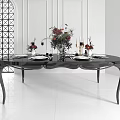 Modern Black Dining Table Set With Floral Arrangement Tableware And Candles In White Room