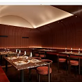 Elegant Restaurant Interior With Wooden Walls Marble Dining Tables Red Seats And Ambient Lighting