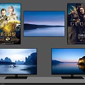 Two Televisions Displaying Scenic Mountain And Castle Views With Posters On Wall