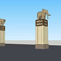 Ornate Columns With Elephant Sculptures And Decorative Patterns Against Blue Sky
