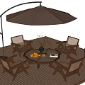 Outdoor Table with Umbrella Chairs Fruit Vase and Lantern on Wooden Deck