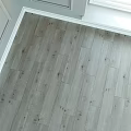 Light Gray Wooden Floor With Natural Wood Grain And Smooth Surface Design