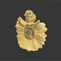 A red headed bird perched on yellow sunflower shaped decorative ornament