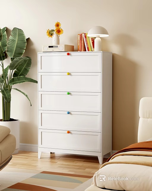 White Dresser With Multiple Drawers Colorful Knobs And Books On Top Green Plant Beside 3d model 