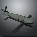 Green Military Aerial Bomb With Tail Fins Metallic Wing Structure And Nose Cone