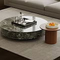 Round Marble Coffee Table with Tray Glass Bottle and Wooden Side Table Holding Fruit Bowl