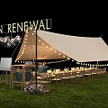 Urban Renewal Outdoor Tent With String Lights Tables Chairs And Flower Bouquets On Grass