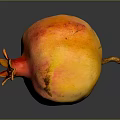 Yellow and Red Pomegranate with Speckled Skin on Dark Background with Reflection