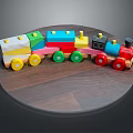 Colorful Wooden Toy Train on Round Wooden Table with Multicolored Wheels