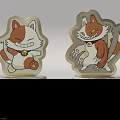Two Decorative Cartoon Cat Ornaments Different Poses With Silver Glitter Base And Golden Accents