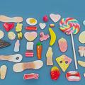 Assorted Colorful Candies Including Lollipops Heart Shapes And Sweets On Blue Background