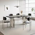 Modern Dining Table Set With Black Chairs Natural Light Decorative Painting And Pendant Light