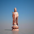 Standing Copper Buddha Sculpture With Lotus Base And Blue Sky Background