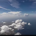 Two White Military Missiles Flying With Smoke Trails Over Cloudy Sky