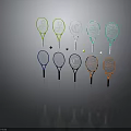 Colorful Tennis Rackets with Various Designs and Tennis Balls on