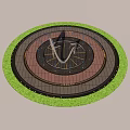 Modern Circular Water Fountain with Colorful Paving and Green Plant Surroundings