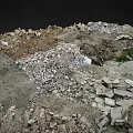 Rocky Mountainous Terrain With Debris Soil And Small Vegetation