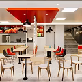 Modern Restaurant Interior With Red Black Chairs Tables Circular Colorful Wall Decor And Pendant Lights