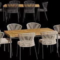 Outdoor Wooden Table With Rattan Chairs And Light Colored Seating For Dining