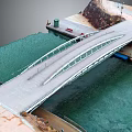 Pedestrian Bridge Over Water With Metal Frame And Stone Embankment Walkway