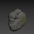 Gray Stone Frog Sculpture With Textured Surface And Yellow Spots On Natural Rock