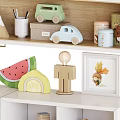 Kids Playroom Decorative Cabinet With Toys Globe Cactus And Building Blocks