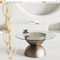 Minimalist Glass Top Coffee Table With Gold Base Black Cup White Books And Woven Decoration