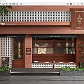 Cafe Storefront With Red Brick Wall Glass Windows Coffee Chai Tea Signage And Green Plants