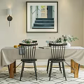 Dining Table Set With Tablecloth Black Chairs Wooden Legs And Flower Centerpiece