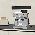 Silver Toaster And Coffee Machine On Kitchen Counter With Bread Cup And Milk Jug