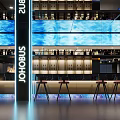 Modern Hotel Lobby With Blue LED Screens Bar Counter High Stools And Ambient Lighting