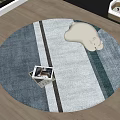 Round Area Rug With Blue Gray Striped Design And White Bear Plush On Photo Box
