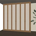 Modern Wooden Wardrobe With Woven Panel Doors In Bright Interior Space With Plant