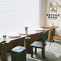 Stylish Bay Window Cabinet Interior With Round Tables Chairs And Blinds