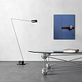 Glass Coffee Table With Metal Base Spherical Accents And Books Near Blue Wall Art