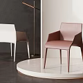 Modern Minimalist Single Chair in White and Blush Leather with Armrests on Round Display Platform