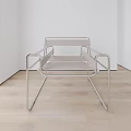 Minimalist Modern Single Chair With Stainless Steel Frame And Sleek Armrests In Bright Room
