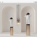White Sculptures Wearing Hats Standing On Gold Pillars With Arched Background Walls And Hanging Lamp