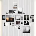 Black and White Photo Wall With Different Size Frames And Scenery People