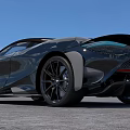 Black Sports Car With Sleek Design Convertible Top Large Alloy Wheels Blue Sky Gray Pavement