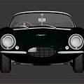 Vintage Green Convertible Sports Car With Red Interior And Classic Design