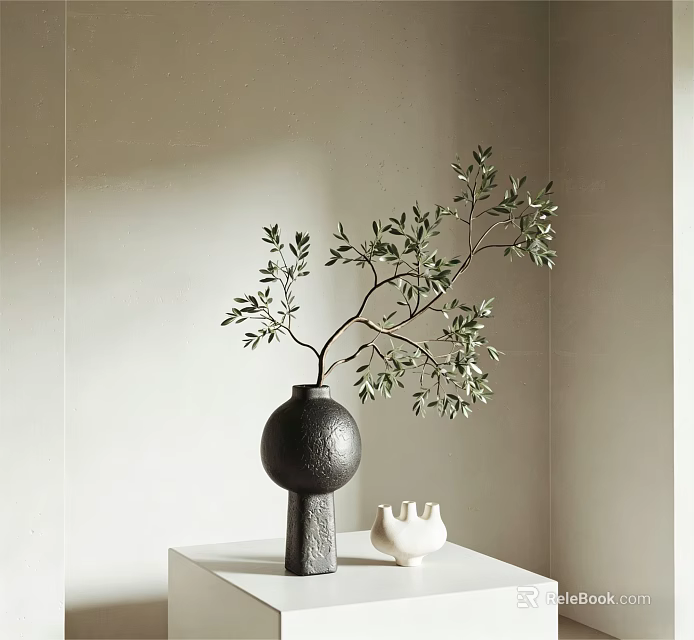 Black Vase With Branch And Green Leaves On White Table With Small White Decoration 3d model 